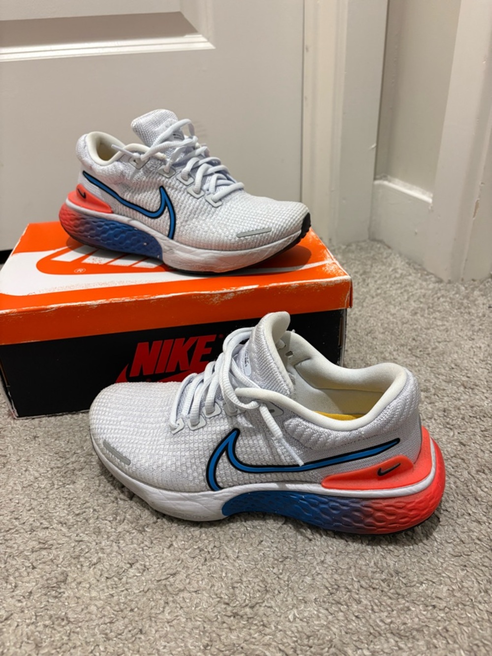 Nike White Women's Running Sneakers with Blue Swoosh and Coral Heel